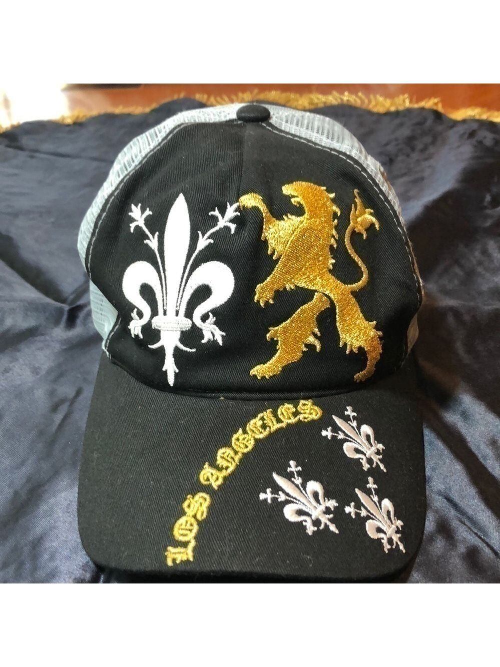  — Black /grey hat with white/gold embroidery.